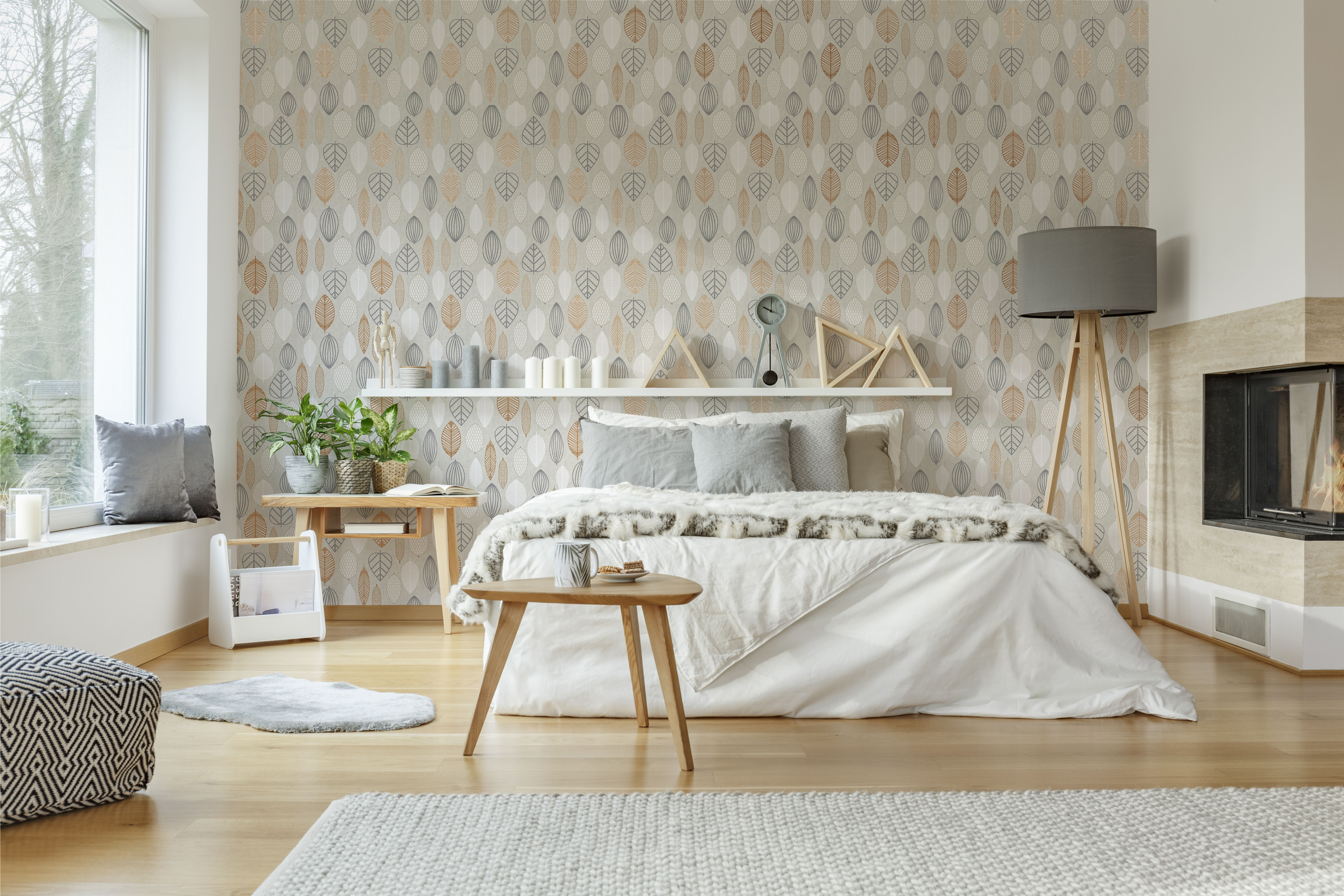 Cozy, spacious bedroom interior with king-size bed, lamp, rug, table, fireplace and big window