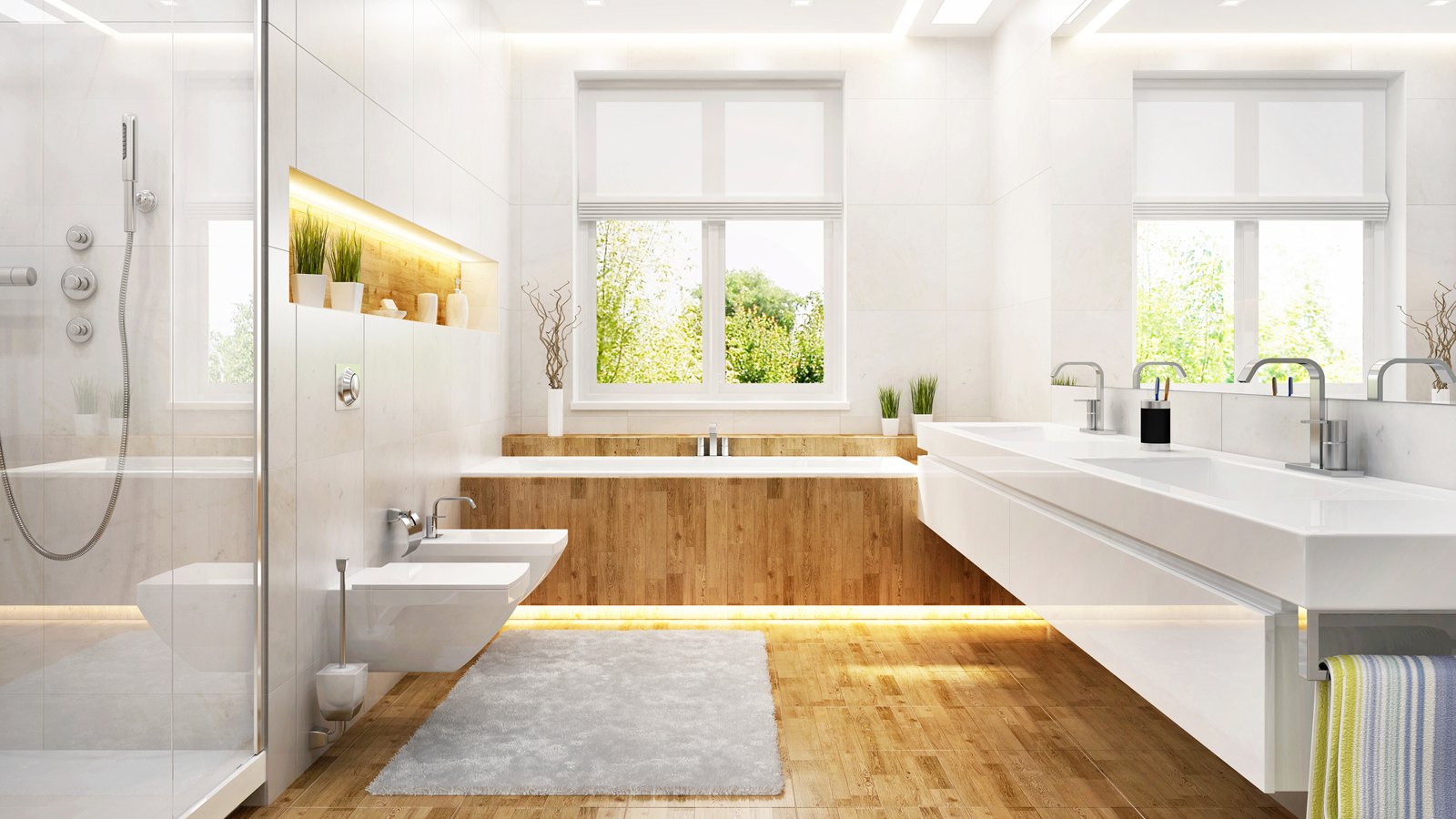 Modernes Badezimmer mit Holzboden und weißen Objekten.