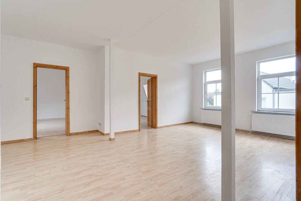 Mit bereits renovierten Wohnungen...