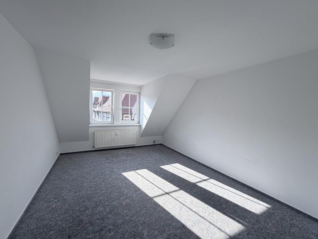 Dachgeschosswohnung mit Einbauküche in Wernigerode! - Foto 4