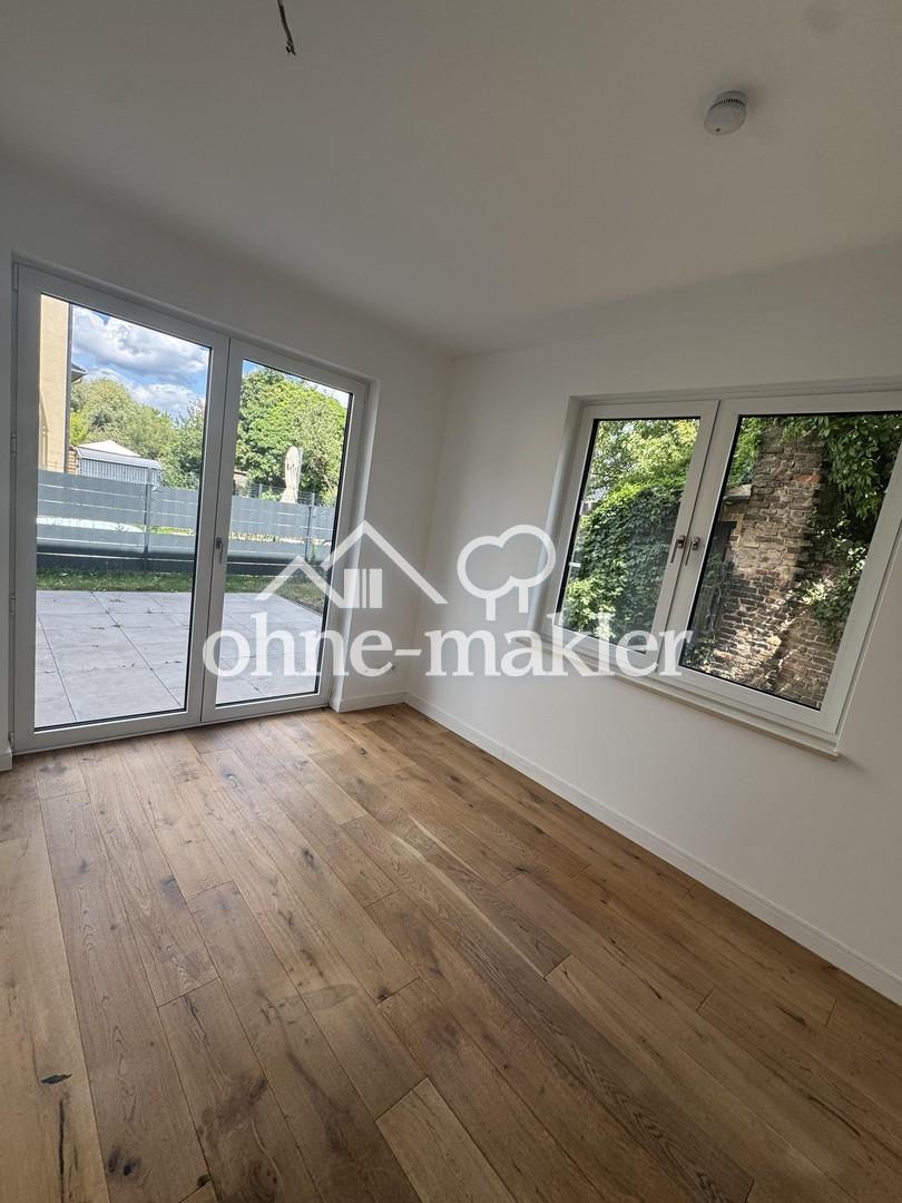 Traumhafte 4 Raumwohnung mit großem Garten in einer Villa - Foto 1