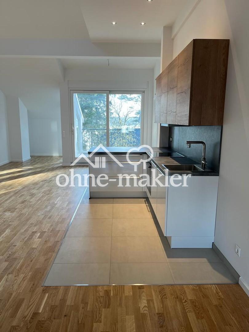 Wunderschöne Dachgeschosswohnung mit Blick auf den See - Foto 4