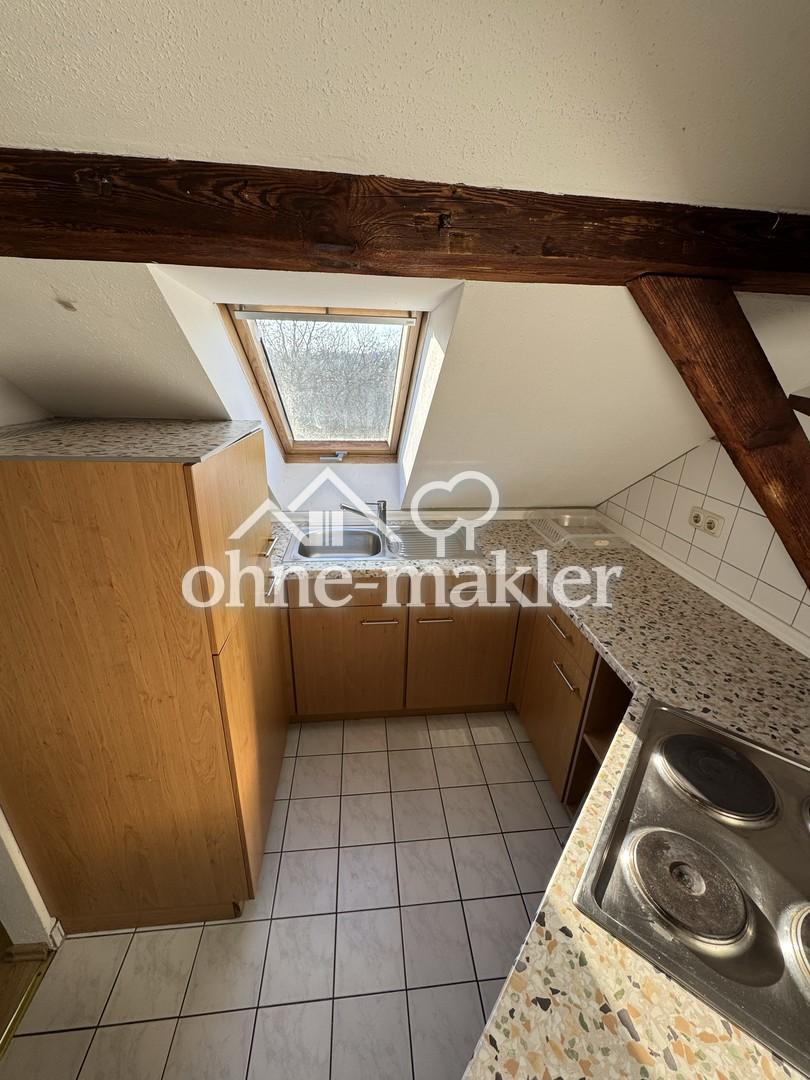Gemütliche Dachgeschosswohnung mit Einbauküche - Foto 3