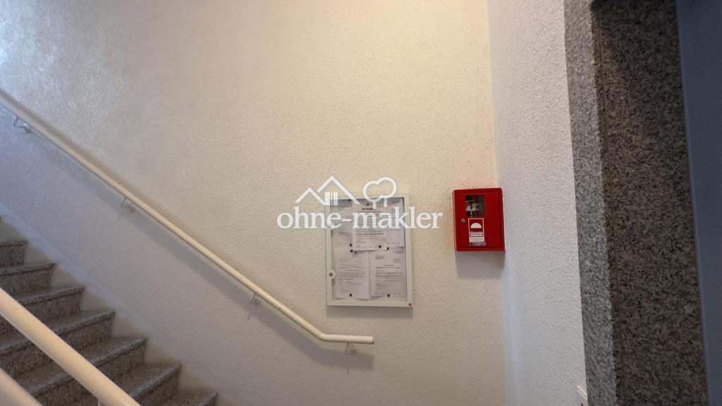Treppenhaus mit Infokasten
