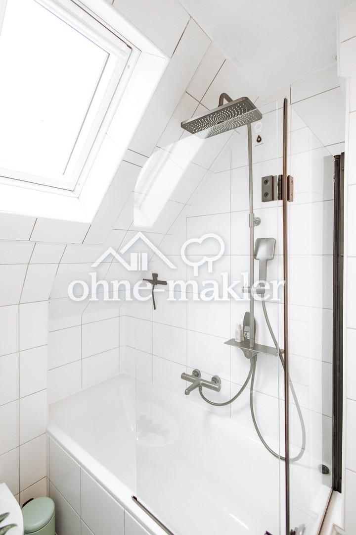bathtub with rain shower