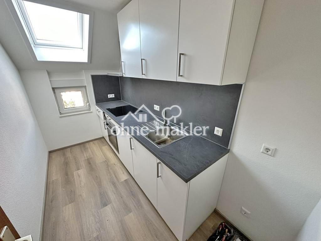 Dachwohnung (2.OG) mit EBK, Dachterrasse + Stellplatz in angenehmer Lage von Kirrlach! - Photo 1