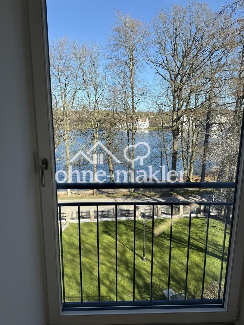 Exklusive Dachgeschosswohnung mit Schloss- und Seeblick in repräsentativer Villa - Photo 3