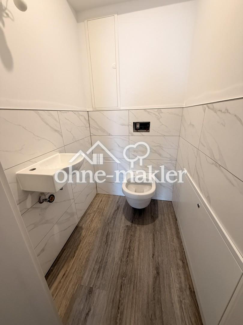 Erdgeschosswohnung mit Garage und Garten, kernsaniert mit gehobener Ausstattung im Erstbezug - Photo 5
