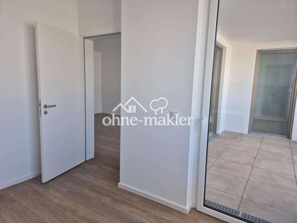 Hochwertiger Erstbezug: Lichtdurchflutete Neubauwohnung mit West-Loggia & neuer Einbauküche - Foto 3
