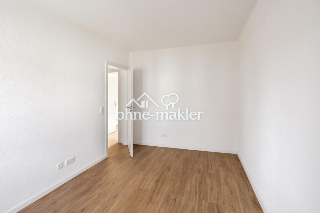 Erstbezug nach Kernsanierung: Helle 3-Zimmer-Wohnung in Mehrfamilienhaus mit Balkon (EG) - Photo 5
