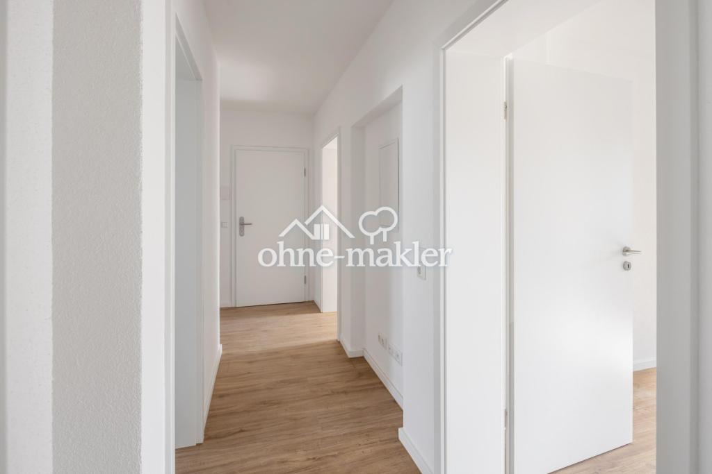 Erstbezug nach Kernsanierung: Helle 3-Zimmer-Wohnung in Mehrfamilienhaus mit Balkon (EG) - Photo 4