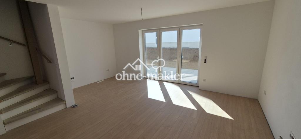 Neubau-Reihenhaus mit Terrasse 140 m² Familienhaus mit sehr niedrigen Energiekosten (EH-40 + PV) - Foto 1