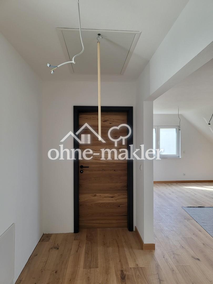 Erstbezug: Helle 2‑Zi‑DG‑Wohnung mit Carport und E‑Ladestation - Foto 4