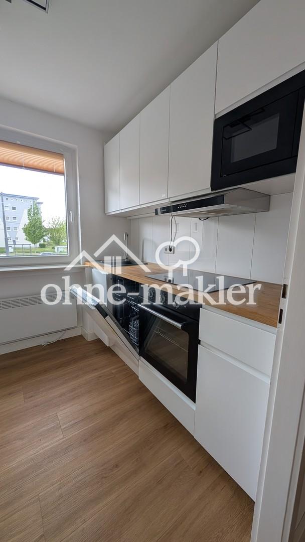 Vollständig renovierte 2-Raum-Wohnung mit Balkon, Einbauküche und eigener Garage - Foto 1