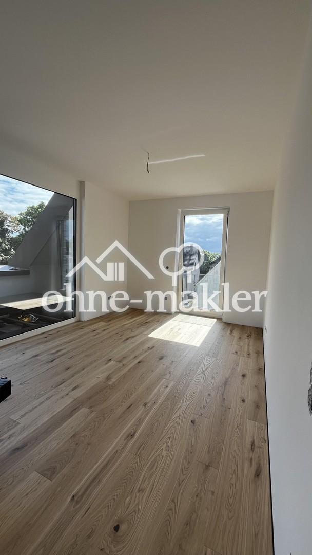 Neubau-Traum im DG: 2 Zimmer, Balkon, EBK inklusive – KfW-40 - Foto 5