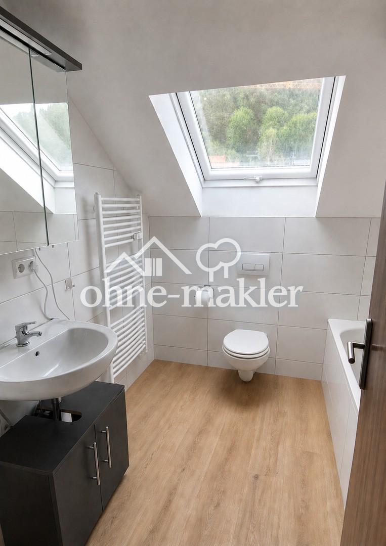 Moderne Dachgeschosswohnung mit Balkon, Garage & Kaminofen in ruhiger Aussichtslage - Foto 4