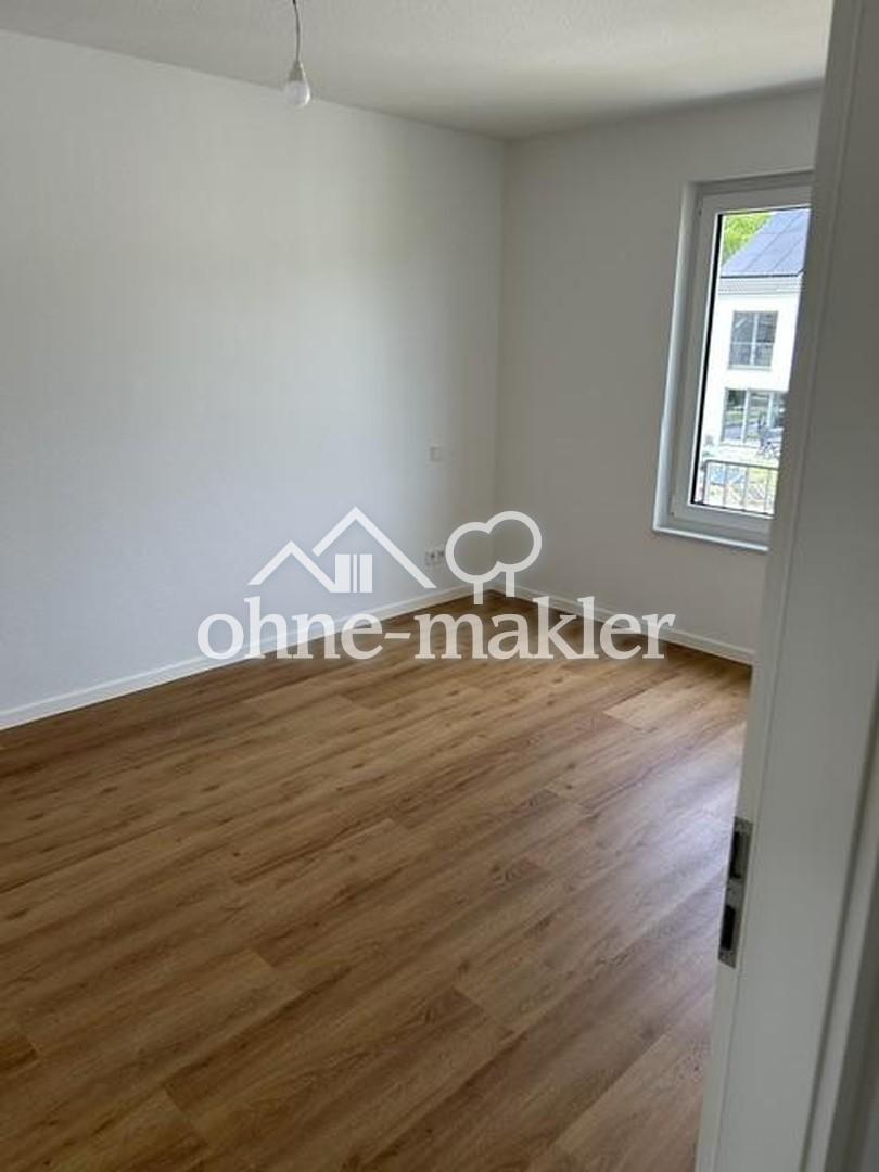 Erstbezug v. privat: Reihenmittelhaus m. Dachterrasse, PV-Anl. m. Wallbox, Garage in Korschenbr. - Foto 3