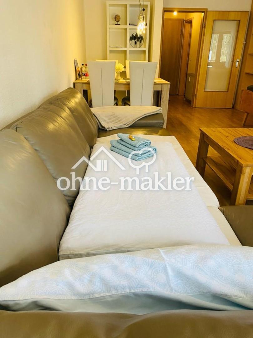 Die Wohnung ist eher praktisch und gemütlich als modern eingerichtet - Photo 1