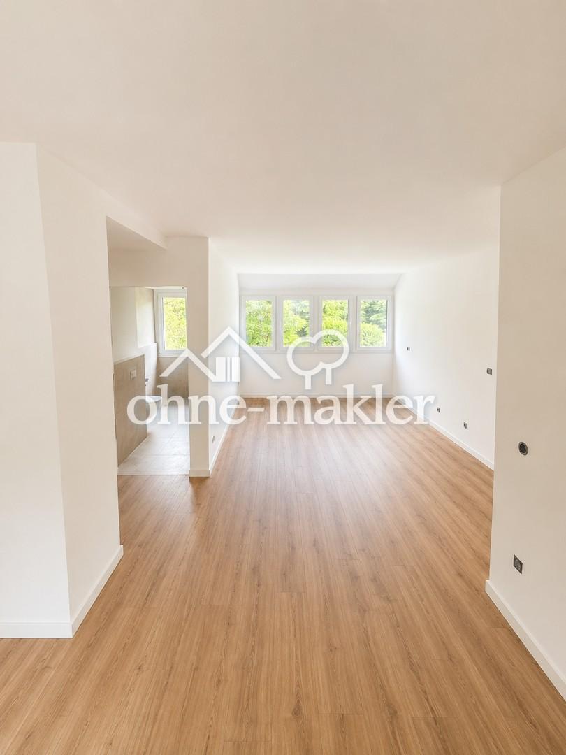 Wohnen wie im eigenen Haus – Exklusive Maisonettewohnung am Wald mit großer Sonnenterrasse - Photo 1