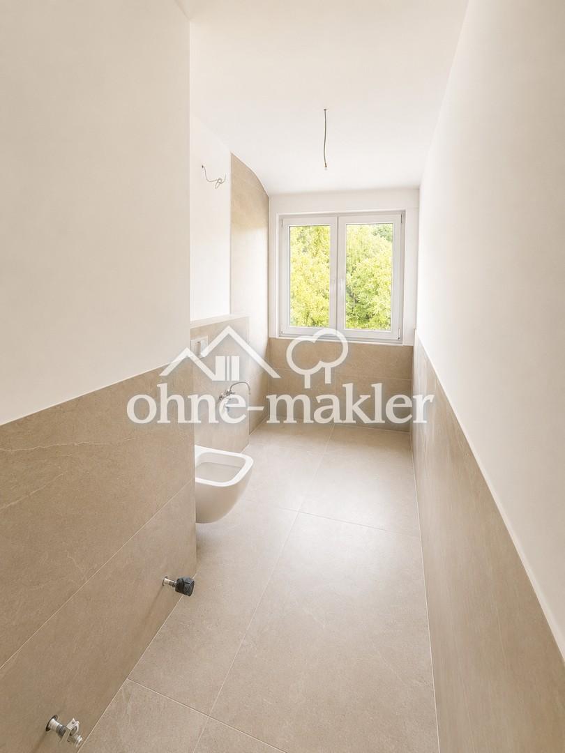 Wohnen wie im eigenen Haus – Exklusive Maisonettewohnung am Wald mit großer Sonnenterrasse - Photo 2
