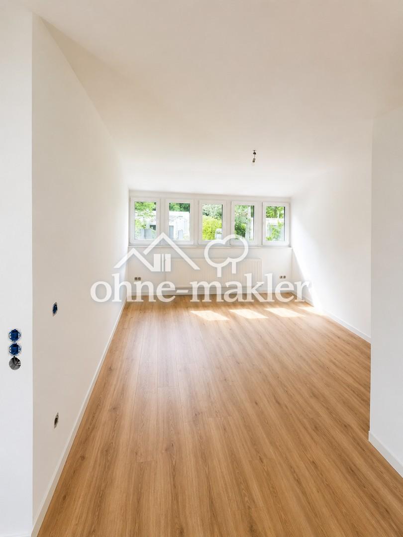 Wohnen wie im eigenen Haus – Exklusive Maisonettewohnung am Wald mit großer Sonnenterrasse - Photo 1