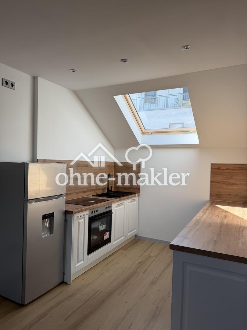 Schöne 2 Zimmer Dachgeschosswohnung - Foto 1