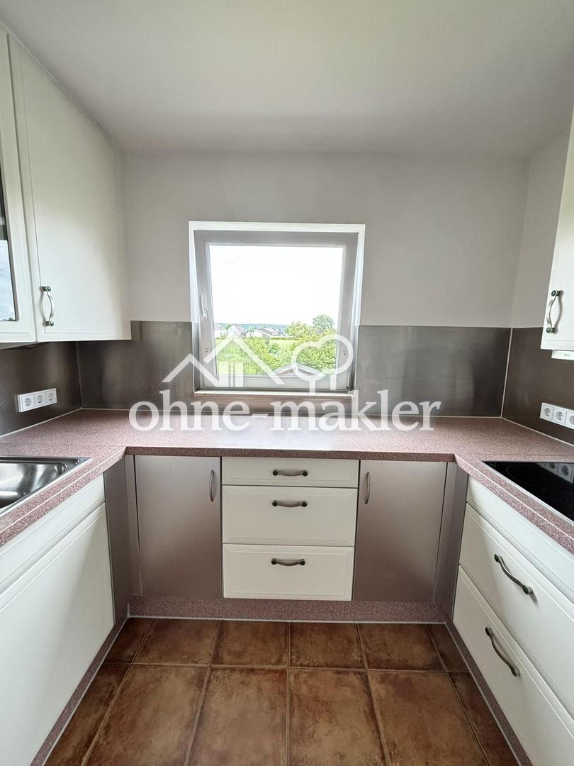 Charmante OG-Wohnung mit Balkon, hochwertiger Einbauküche und Parkplätzen - Foto 4
