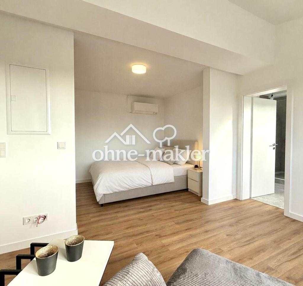 Erstbezug: Modernes Dachgeschoss-Appartement mit Küche, Klimaanlage und Fußbodenheizung - Foto 3