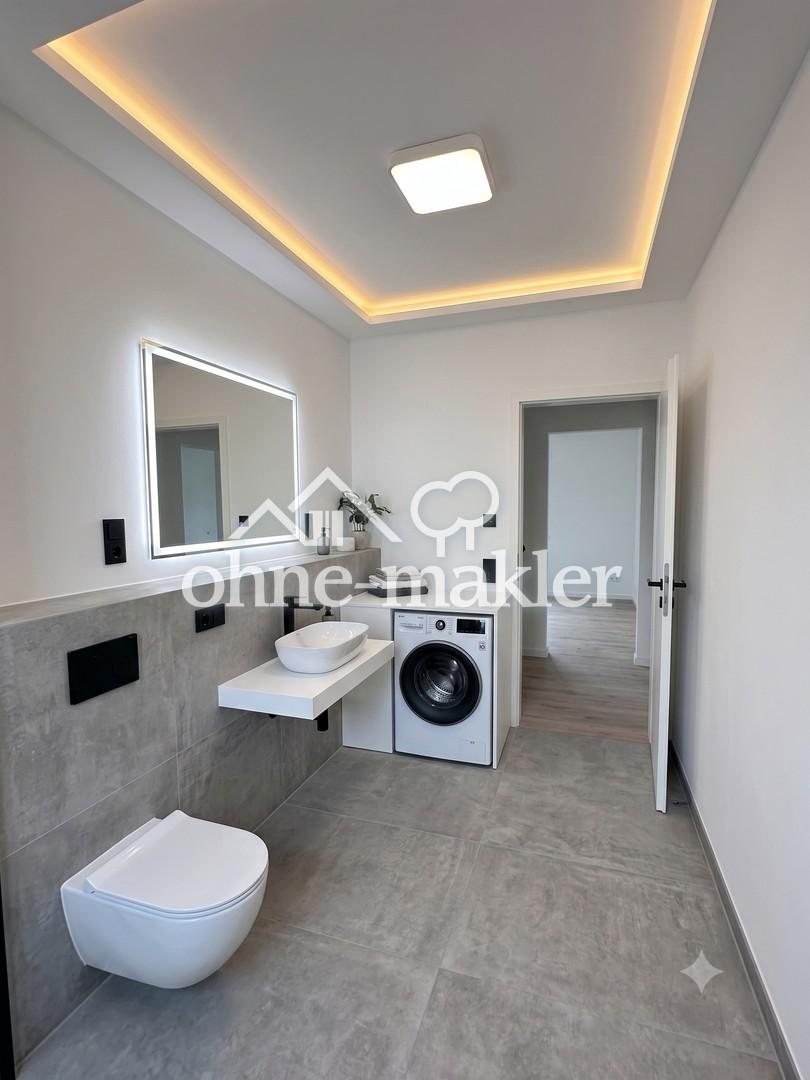 Exklusiver Erstbezug 2-Zimmer-Wohnung mit Klimaanlage, Einbauküche und Balkon in Berlin-Spandau - Photo 4