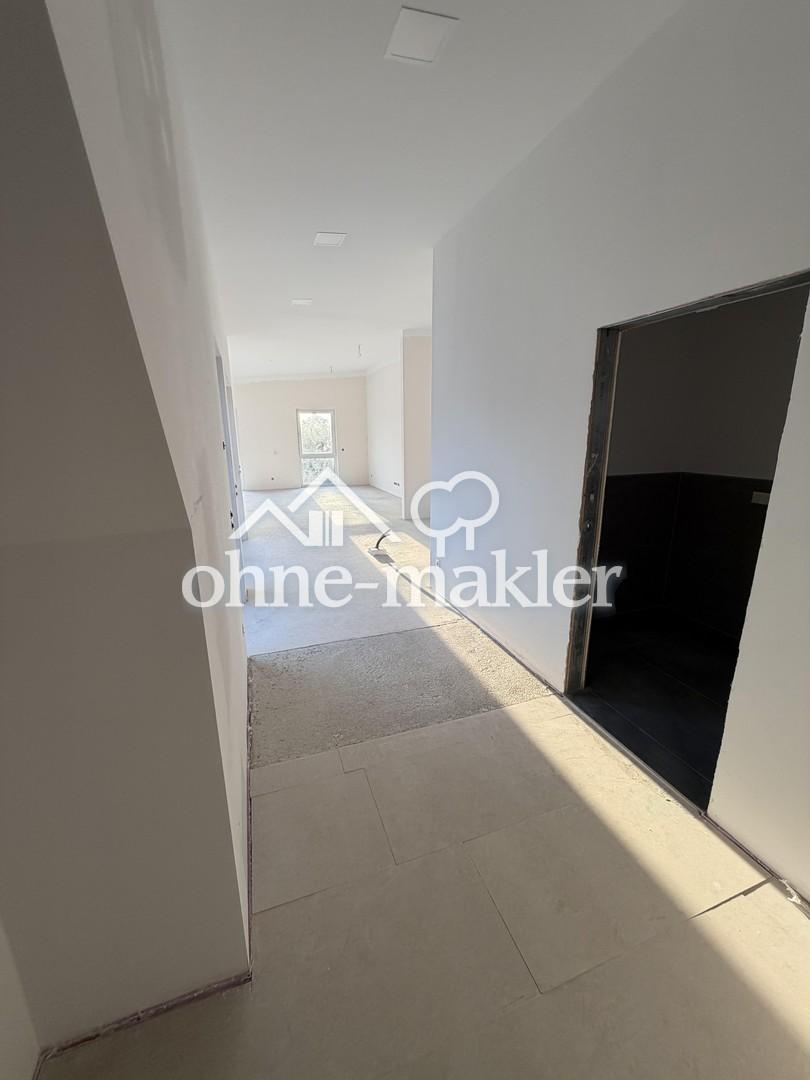 Ländliche Ruhe trifft moderne Eleganz-Exklusive Neubauwohnung im ersten Obergeschoss - Foto 5