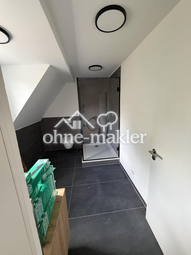 Ländliche Ruhe trifft moderne Eleganz-Exklusive Neubauwohnung im ersten Obergeschoss - Photo 4