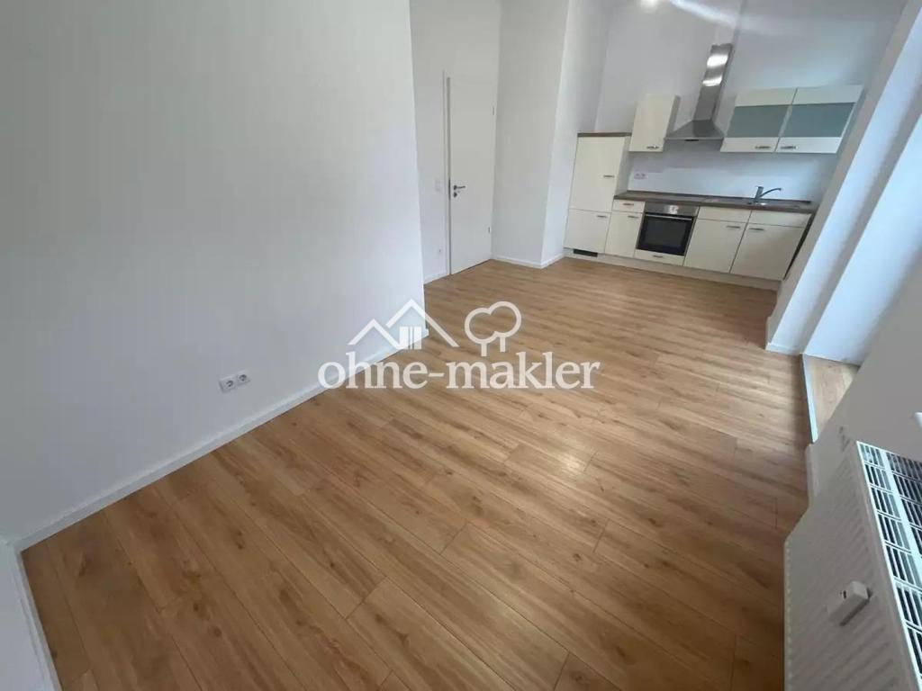 Hochparterre-Wohung mit großzügiger Wohnküche und Balkon - Foto 1