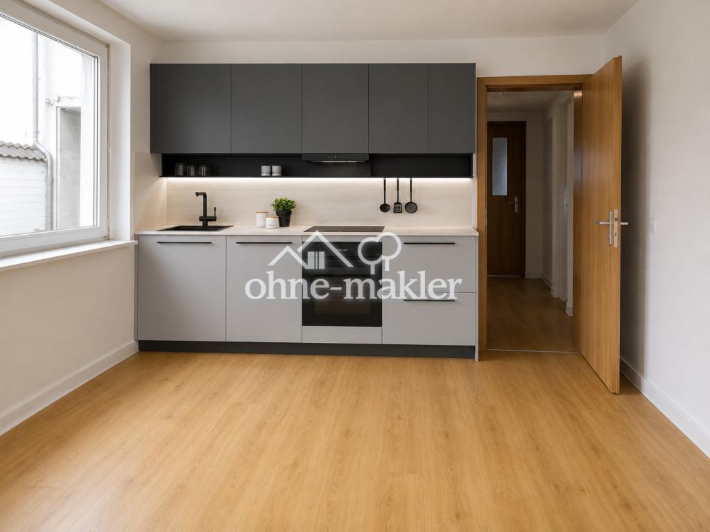Sanierte Erdgeschoss-Wohnung mit Einbauküche, modernes Bad - Foto 2