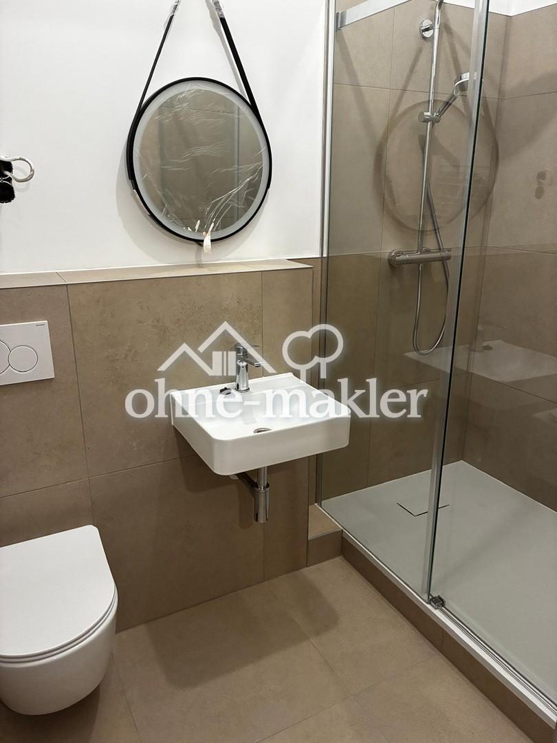 Sanierte Erdgeschoss-Wohnung mit Einbauküche, modernes Bad - Foto 3