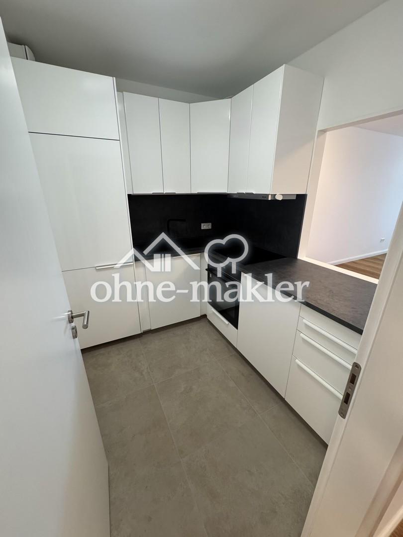 Komplett sanierte 2-Zimmer-Wohnung mit Balkon, Einbauküche und Tiefgaragen-Stellplatz - Foto 3