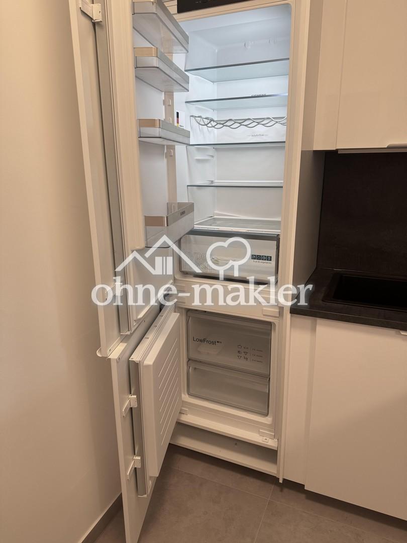 Komplett sanierte 2-Zimmer-Wohnung mit Balkon, Einbauküche und Tiefgaragen-Stellplatz - Foto 4
