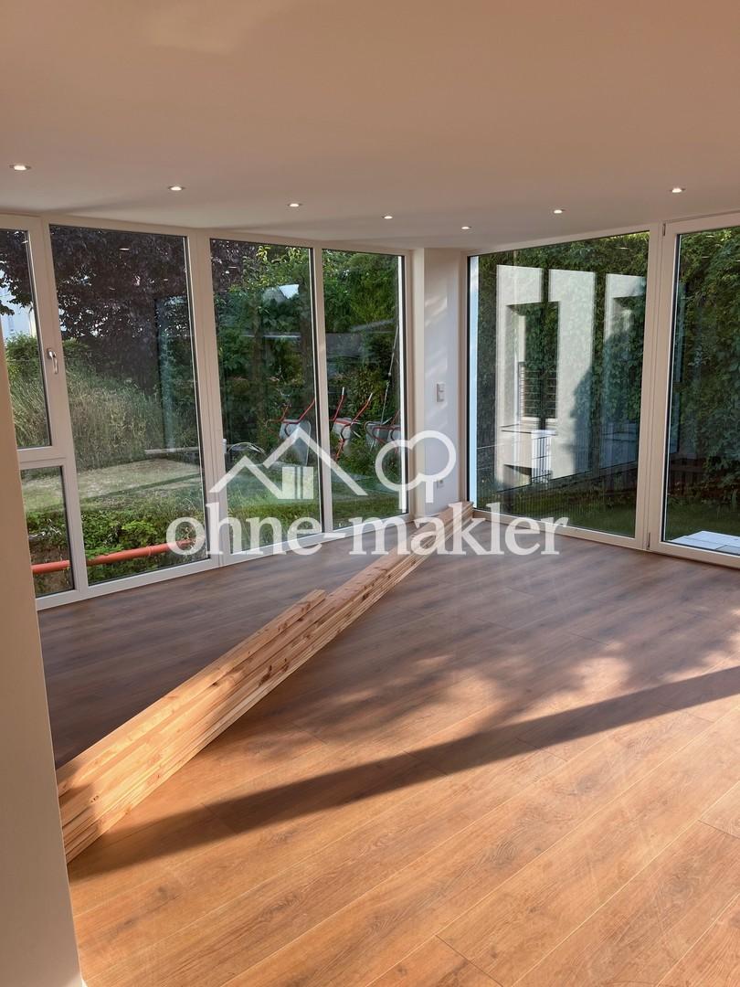 Kernsanierte, lichtdurchflutete Wohnung mit kleinem Garten - Foto 1