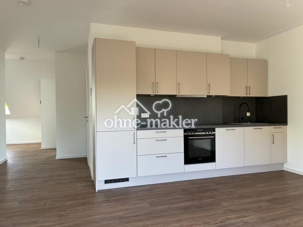 Helle 2 Zi. DG-Wohnung (Neubau) mit EBK, WP, Fussbodenheizung, Aufzug, Balkon u. Stellplatz - Photo 1
