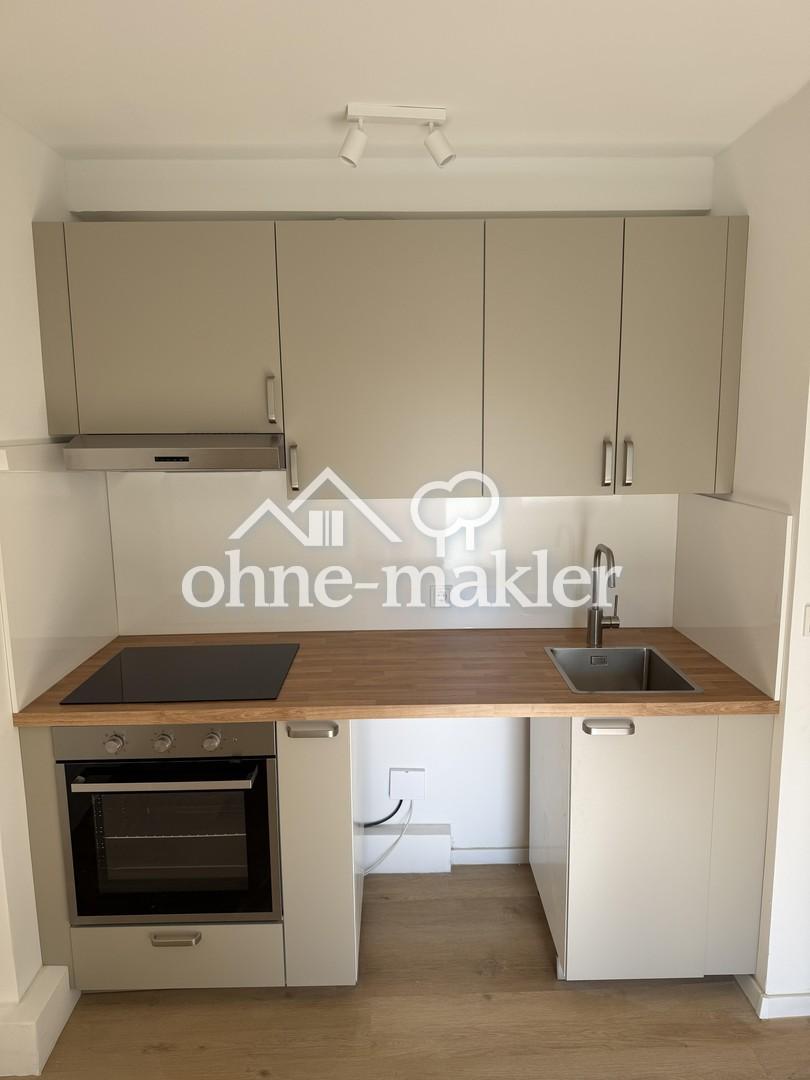 Erstbezug nach Kernsanierung: Moderne 2‑Zimmer Wohnung mit Sonnenbalkon & neuer Einbauküche in Rath - Photo 2
