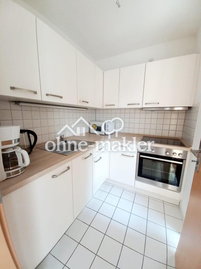 Lichtdurchflutete 1-Zimmer-Wohnung mit moderner Einbauküche & TG-Stellplatz - Foto 4