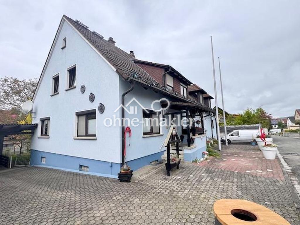 Gepflegte 3-Zimmer-Erdgeschosswohnung mit Balkon, neuer Einbauküche und Garten in Reckendorf - Photo 4