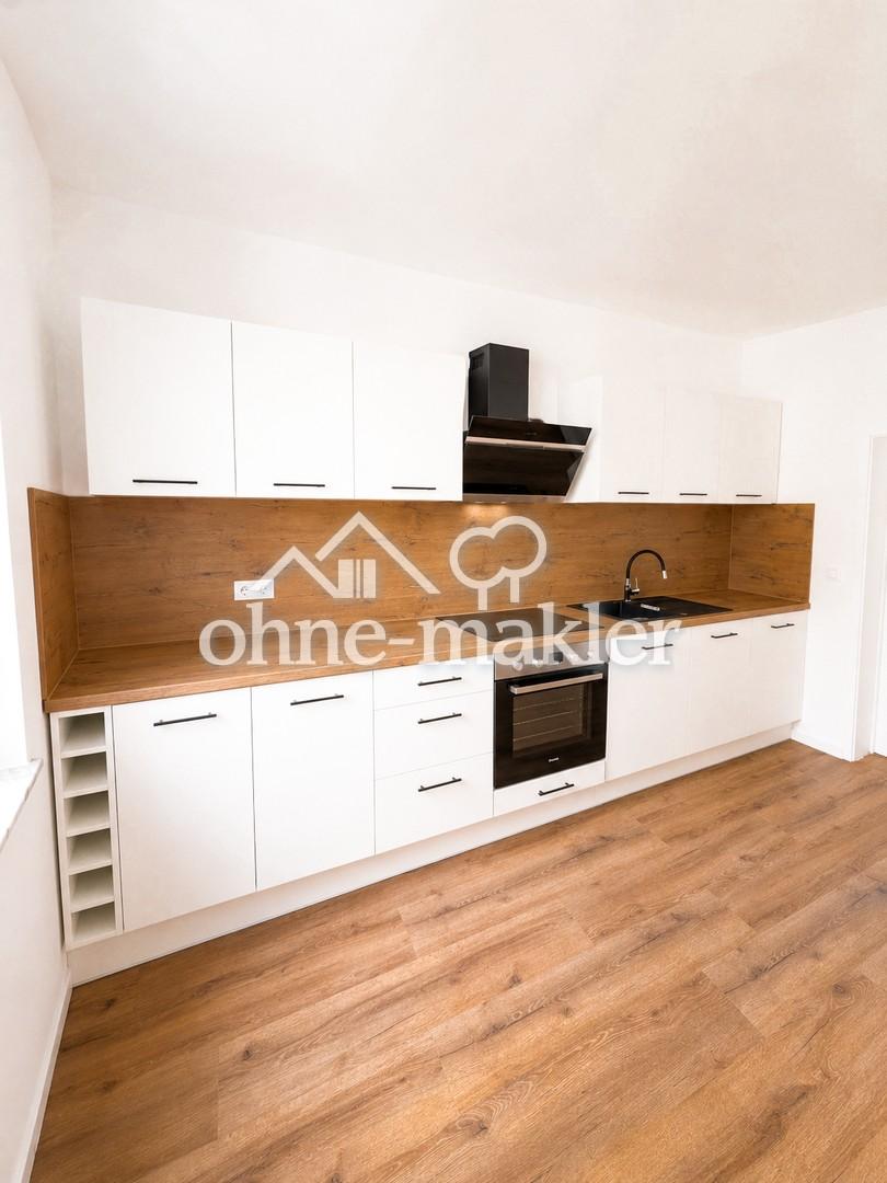 Kernsanierte 4-Zimmer-Wohnung mit moderner Einbauküche in zentraler Lage - Foto 1