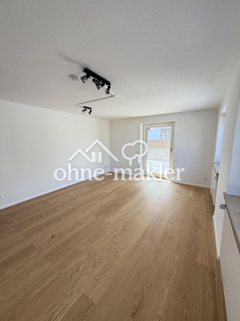 **Erstbezug nach Sanierung** 3-Zimmer-Erdgeschosswohnung mit EBK, sonniger Terrasse und Garage - Foto 1
