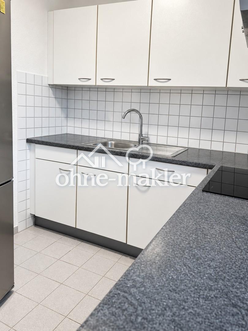 Helle 2-Zimmer-Wohnung mit Einbauküche, Balkon und Tiefgaragenstellplatz - Photo 4