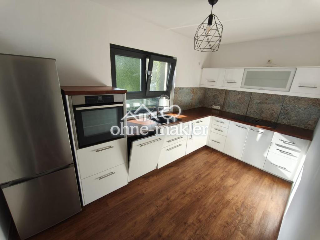Wohnen wie im Haus: sanierte 3-Zimmer-Wohnung mit Kamin, Südterrasse, Garten & Tiefgarage - Foto 5