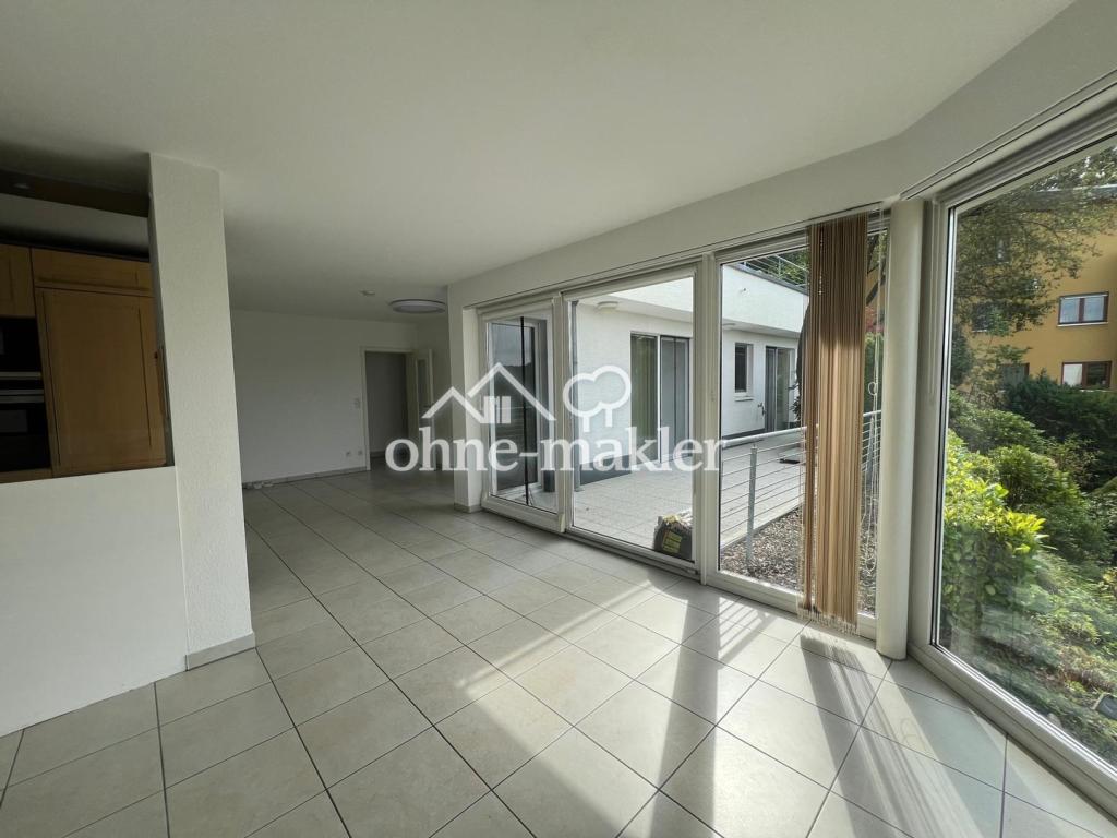Exklusive Terrassenwohnung mit traumhaftem Grünblick, großer Fensterfront & Garage - Foto 4