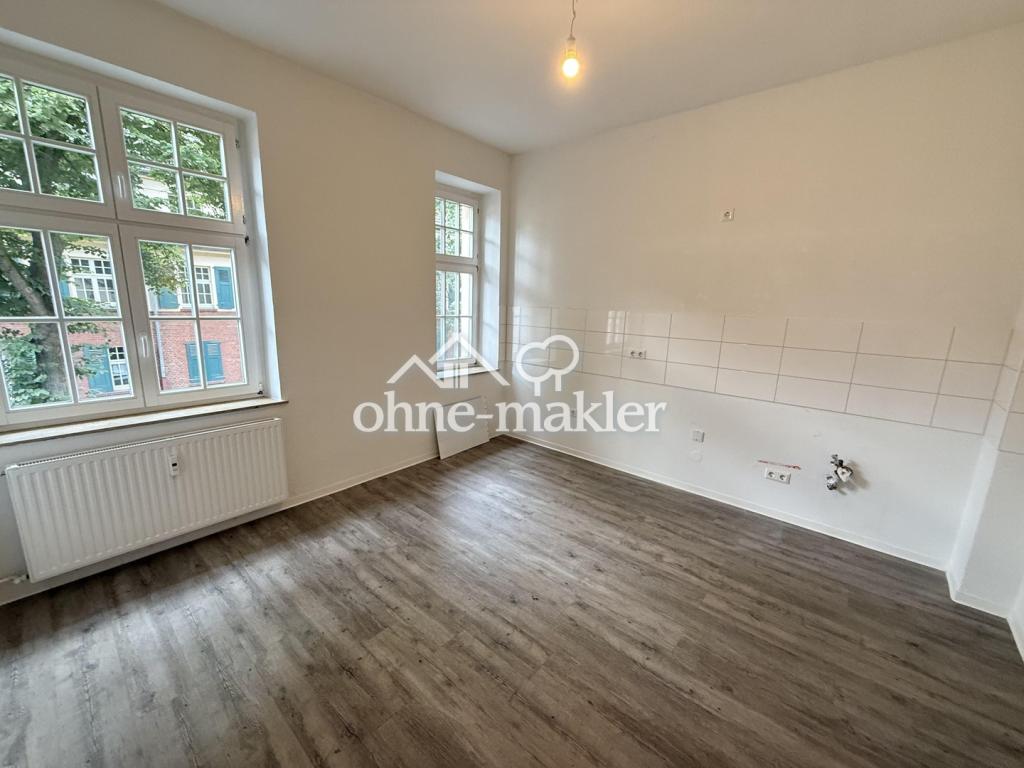 Wohnen mit Grünblick & Geschichte - modernisierte 2-Zimmer-Wohnung mit Balkon und Uhrenturmblick - Foto 4