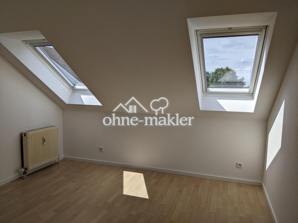 Helle Dachgeschosswohnung mit Dachterrasse und Tiefgaragenstellplatz - Foto 4