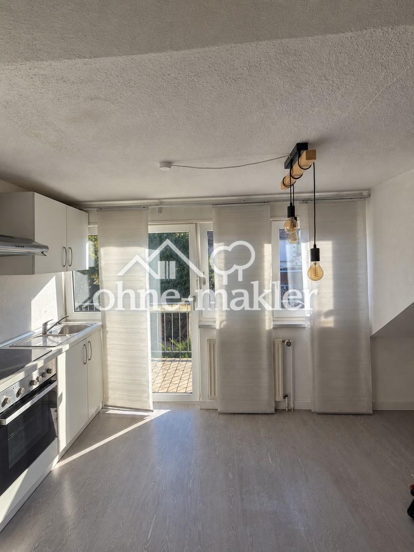Gemütliche 2-Zimmer-Dachgeschosswohnung mit Balkon und Einbauküche in ruhiger Lage - Foto 2