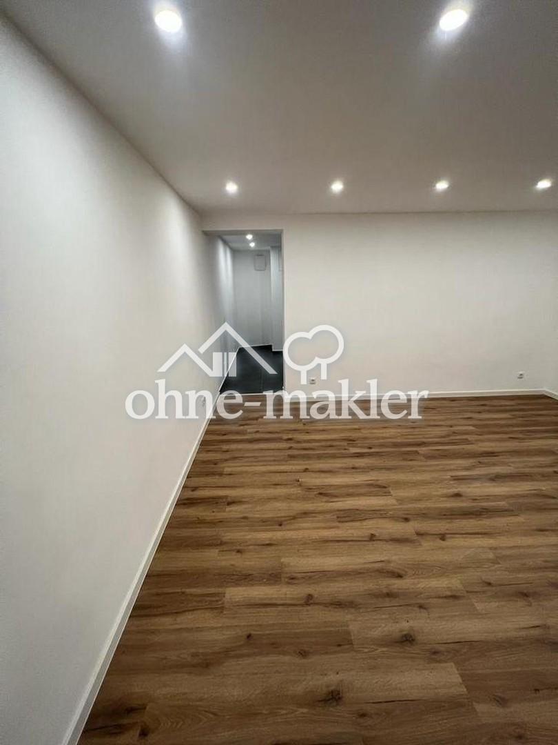 Moderne Souterrainwohnung mit Garten - Foto 1